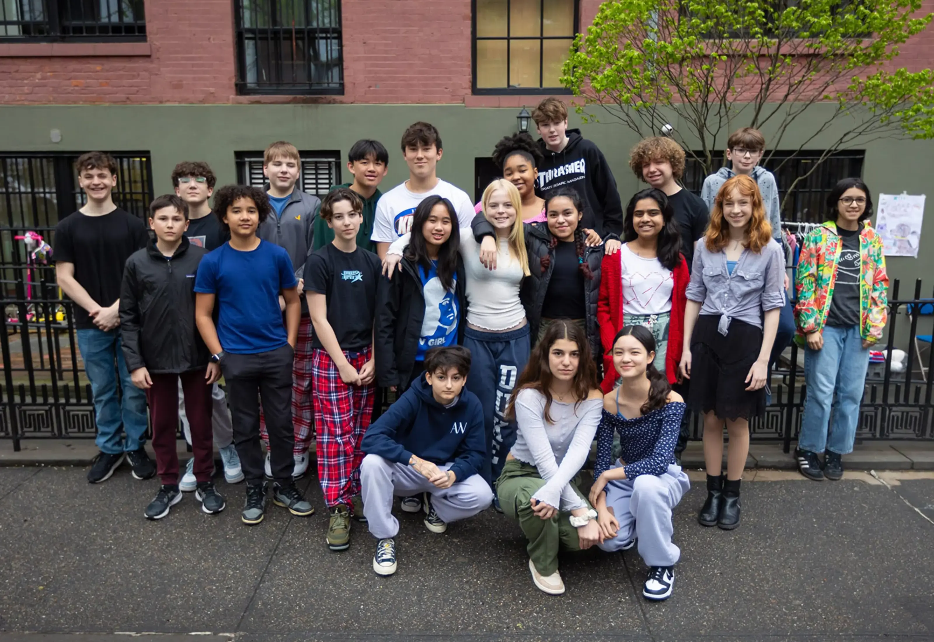 students-posing-outside-school-campus